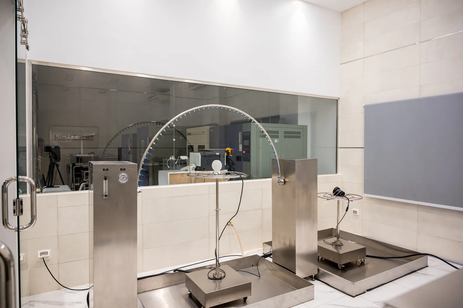 The ingress-protection rig — the oscillating tube used for IPX3 and IPX4 water testing.